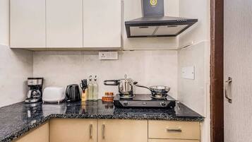 Fridge, microwave, stovetop, coffee/tea maker