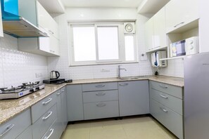 Fridge, microwave, stovetop, coffee/tea maker