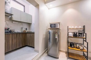Fridge, microwave, stovetop, coffee/tea maker