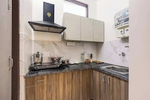 Fridge, microwave, stovetop, coffee/tea maker