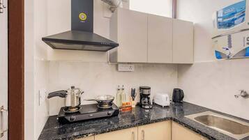 Fridge, microwave, stovetop, coffee/tea maker