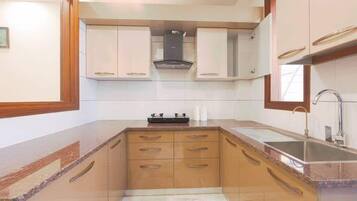 Fridge, microwave, stovetop, coffee/tea maker