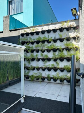 A modern building with a unique vertical garden feature.
