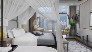 A modern hotel room with a large bed, a bedside table, a chair, and a view of the cityscape. - Chongqing Sujiang Yunduan Riverview (Chongqing)