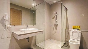 A modern bathroom with a glass-enclosed shower, a sink with a mirror, and a toilet. - Beautiful 4 Bedroom Private Pool Villa in Laguna Bangtao, Daily Cleaning (Tambon Choeng Thale)