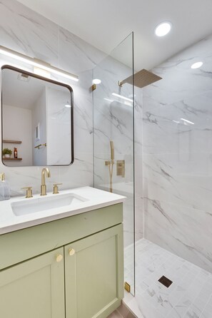 Shower, hair dryer, towels, soap