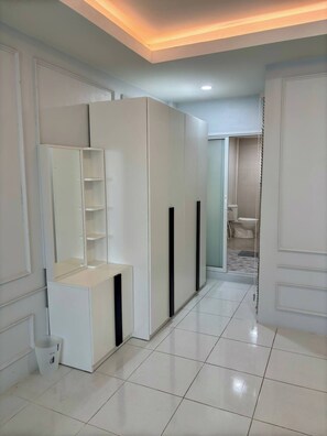 Ample storage and a convenient console table make this room a haven for relaxation.