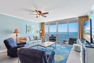 Signature Condo, 3 Bedrooms, Balcony, Beach View | Living room | 50-inch Smart TV with cable channels