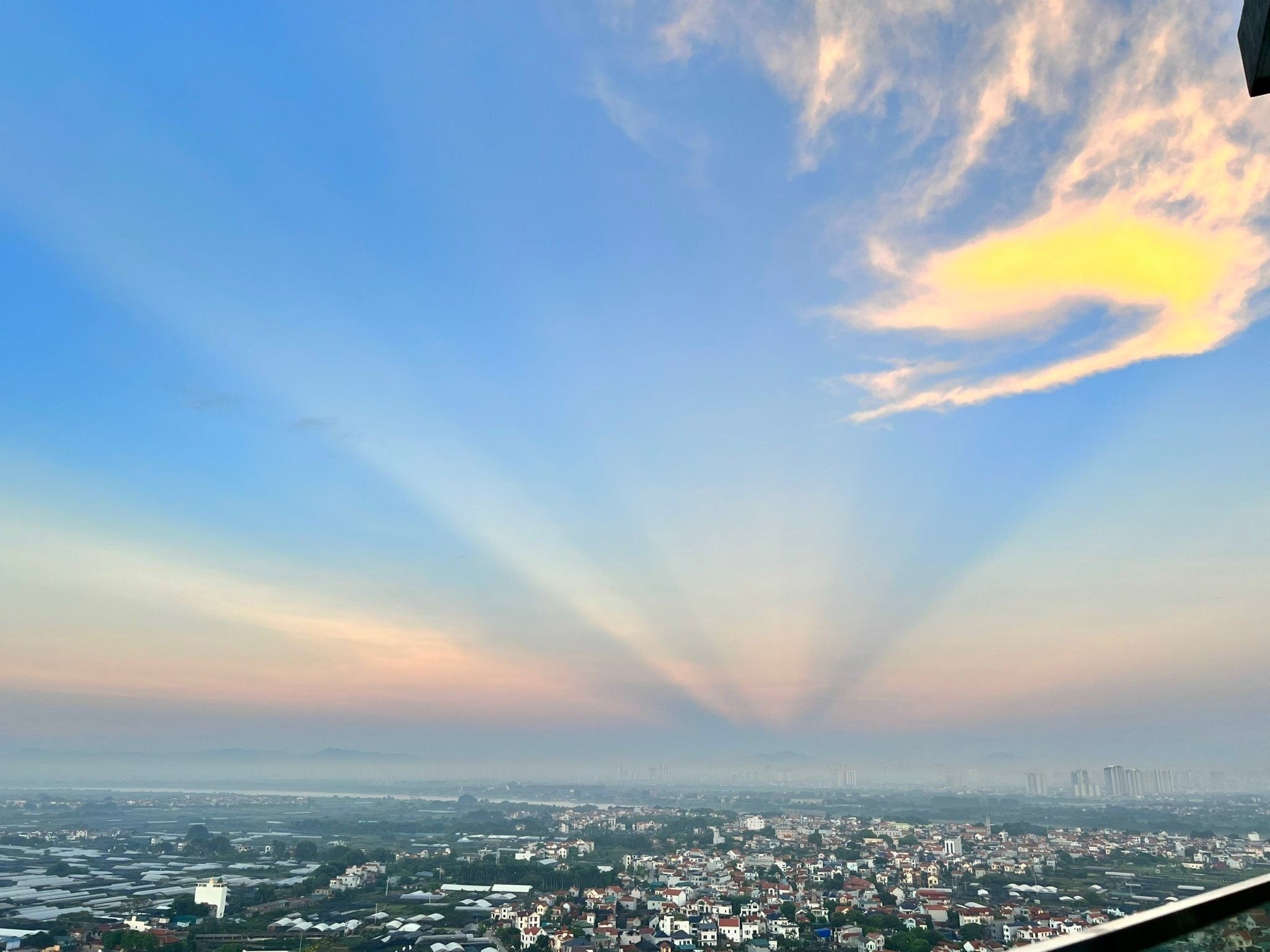 A cityscape with a clear sky and distant buildings.