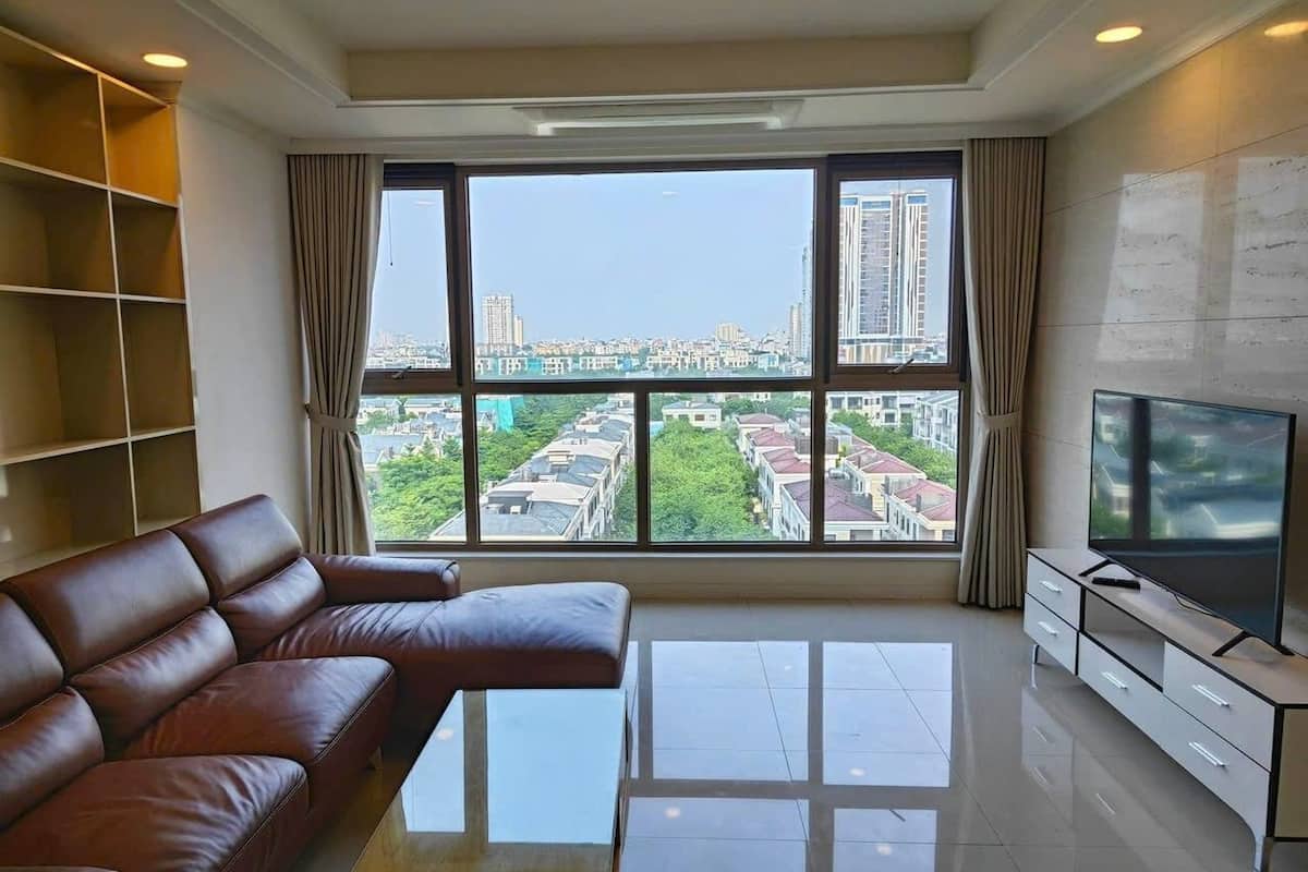 Deluxe Apartment, 2 Bedrooms, Balcony, City View | Living area | 42-inch flat-screen TV with cable channels
