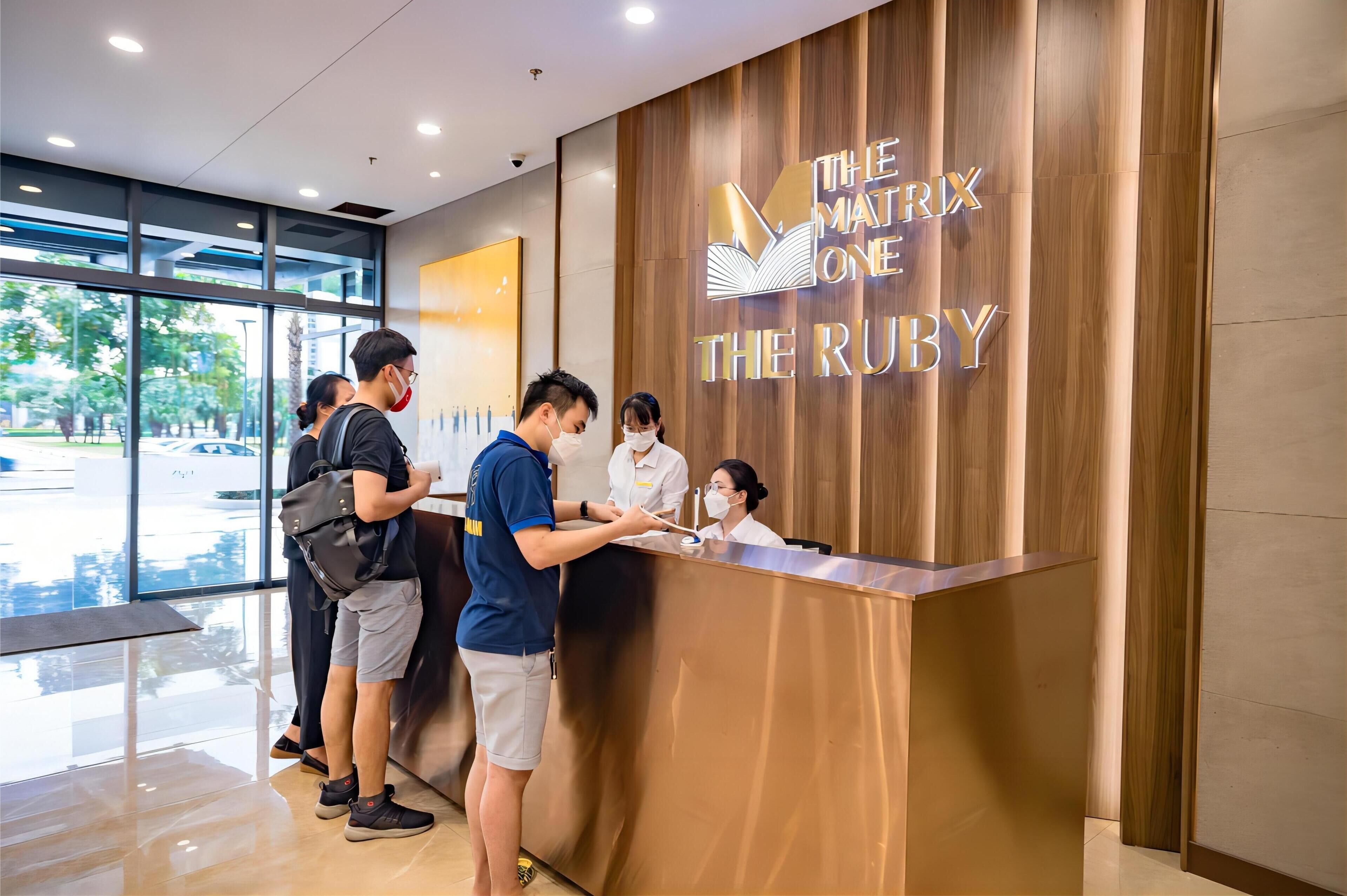 A reception desk with a sign reading "The Matrix One The Ruby".