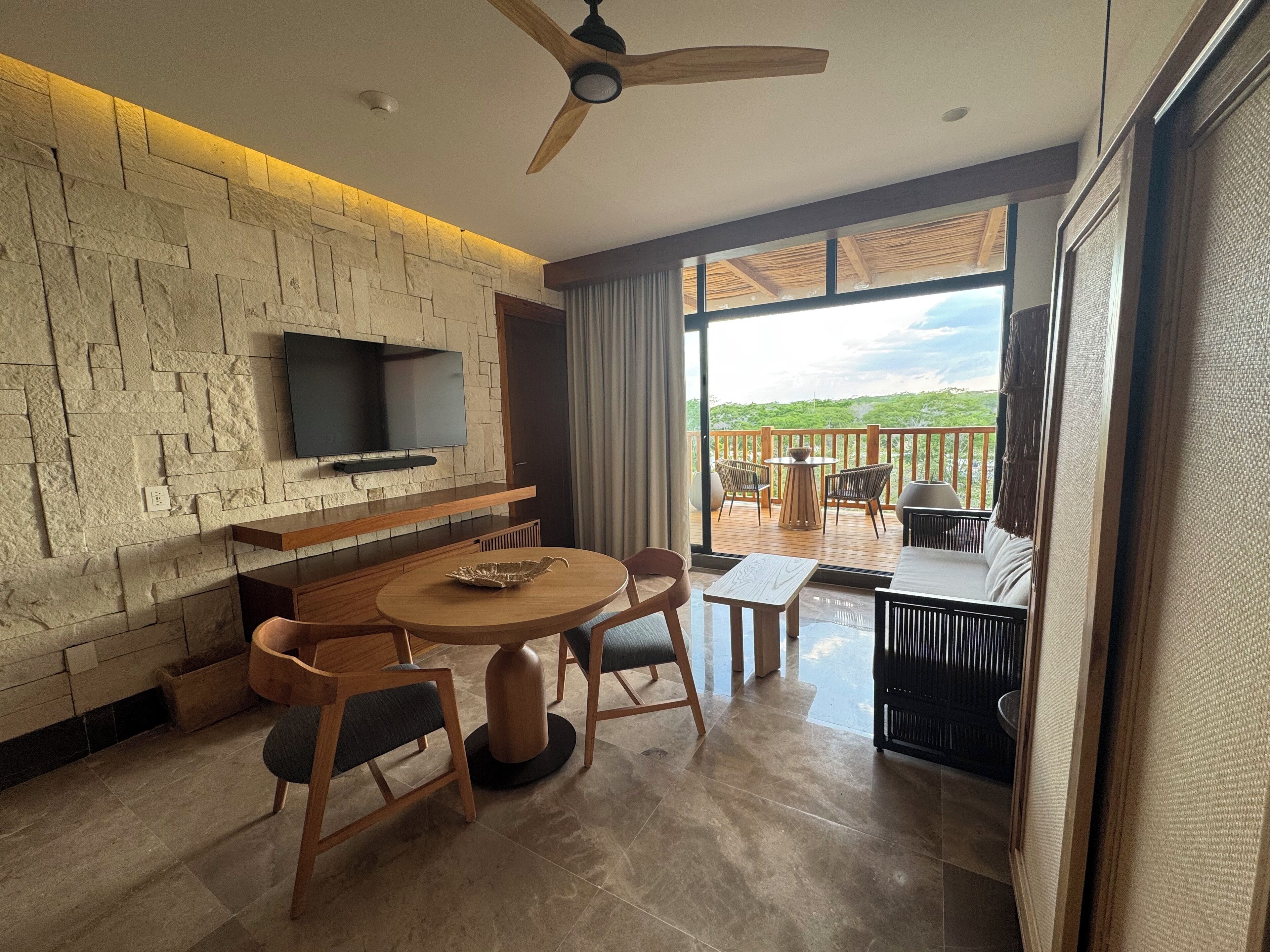 Presidential Suite | Living area | 55-inch flat-screen TV with cable channels, foosball, table tennis