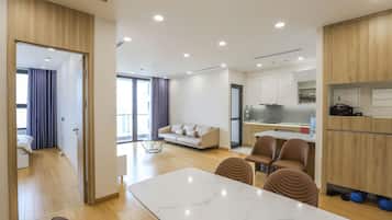 Deluxe Apartment, 3 Bedrooms, Balcony, City View | Living area | 42-inch Smart TV with cable channels