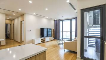 Deluxe Apartment, 3 Bedrooms, Balcony, City View | Living area | 42-inch Smart TV with cable channels