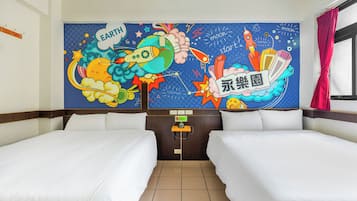 A hotel room with two beds, a large wall mural depicting space and Earth, and a window with curtains.