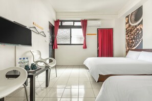 A hotel room with two beds, a desk with chairs, a flat-screen TV, and a window with red curtains. - Forever happiness hostel  (Puli)