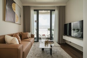 Superior Apartment, 2 Bedrooms, Kitchen, City View | Living area | 42-inch LED TV with cable channels - Vinhomes Smart City by Emily in Town (Hanoi)