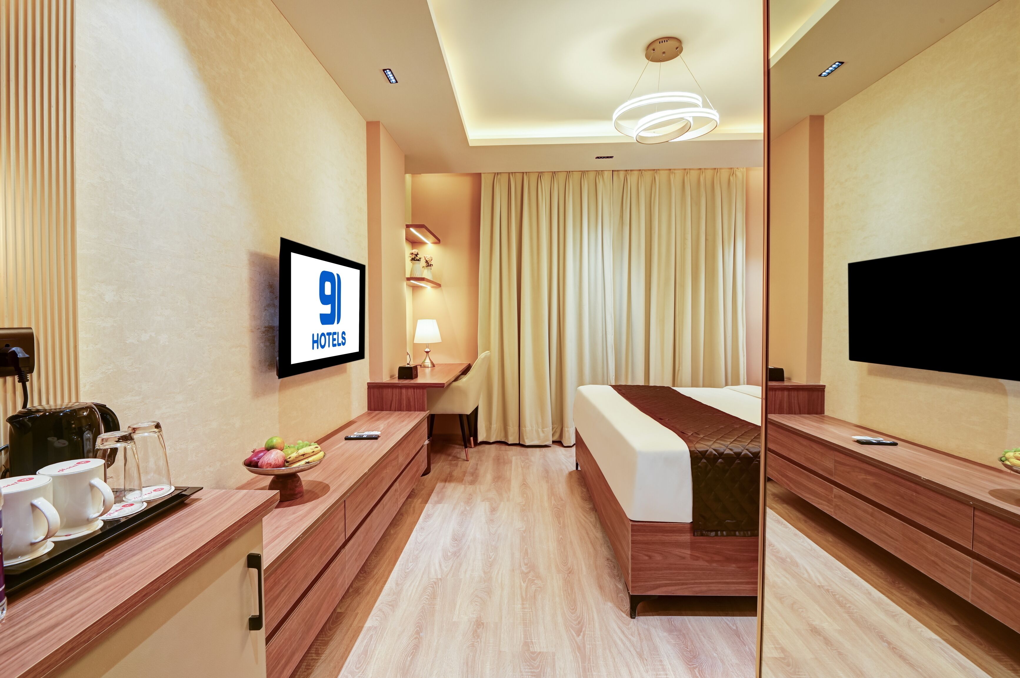 A hotel room with a bed, a desk, a TV, and a coffee maker.