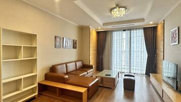 Deluxe Apartment, 3 Bedrooms, Balcony, City View | Living area | 42-inch LED TV with digital channels