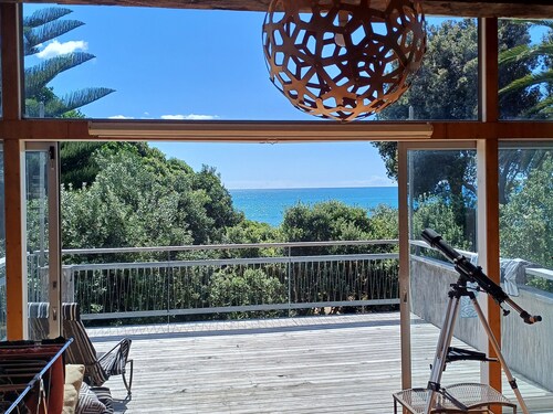 Modern Kiwi family bach right on the beach. Private & pet friendly.