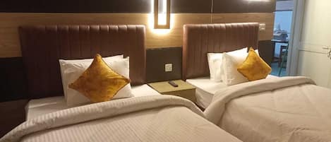 Deluxe Double or Twin Room, City View | 1 bedroom, in-room safe, desk, laptop workspace