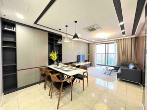 Superior Apartment, 3 Bedrooms, Kitchen, City View | Living area | 35-inch TV with cable channels - Vinhomes D Capitale by Emily in Town (Hanoi)