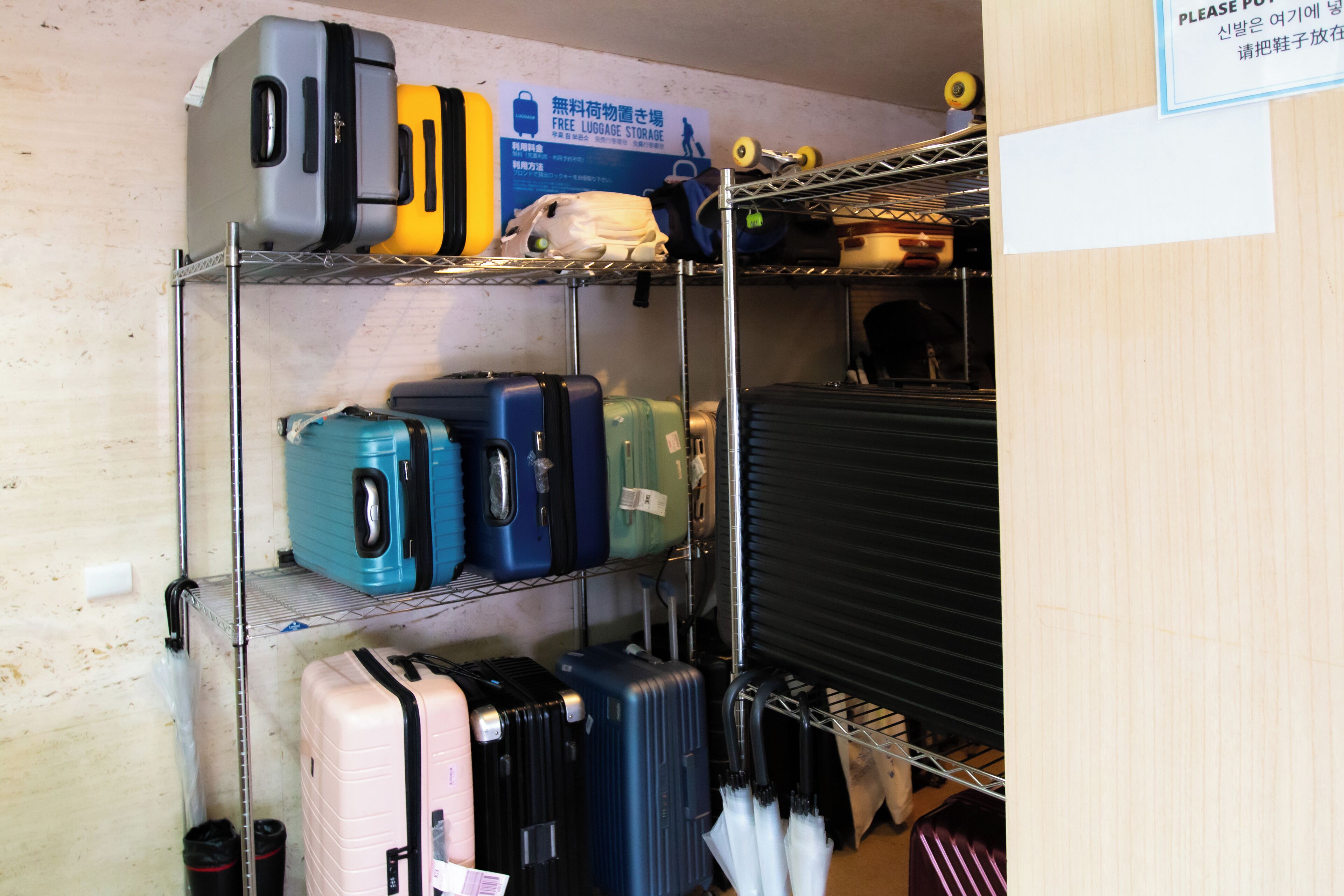A luggage storage area with multiple shelves holding suitcases and bags.