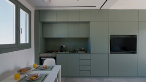 A modern kitchen with a dining area. - The Met Suite 3, elegant stay centrally in Rethymno! (Rethymno)