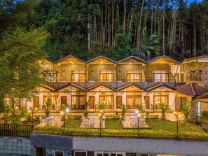 A multi-story hotel with a stone facade, multiple balconies, and outdoor seating areas. - Eagle Regency Kandy  (Kandy)
