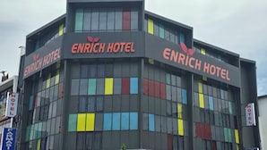 A multi-story building with the signage "ENRICH HOTEL" prominently displayed on the facade. - Enrich Hotel Semenyih by uBook (Semenyih)