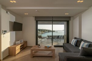 Comfort Apartment, Balcony, Sea View | Living area | 50-inch LED TV with digital channels