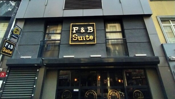 A modern building with a sign for 'F&B Suite' indicating a restaurant or food and beverage facility. - 216 F&B Suites (Istanbul)