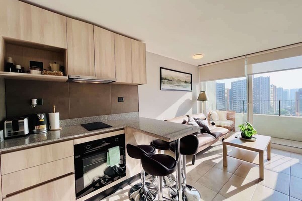 Open kitchen & dining area w/ modern cabinets & breakfast bar seating