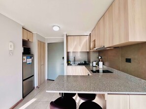 Coffee/tea maker, fridge, microwave, oven