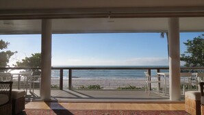 A covered deck with a view of the beach and ocean. - 2973 Shore Ln - 4 Bedroom - Beachfront Home (Boca Grande)
