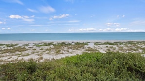 A beach with a clear sky and calm sea. - Luxury Seagrape 01, 3-bedroom, 3-bathroom townhome in Boca Grande with stunning Gulf views. (Boca Grande)