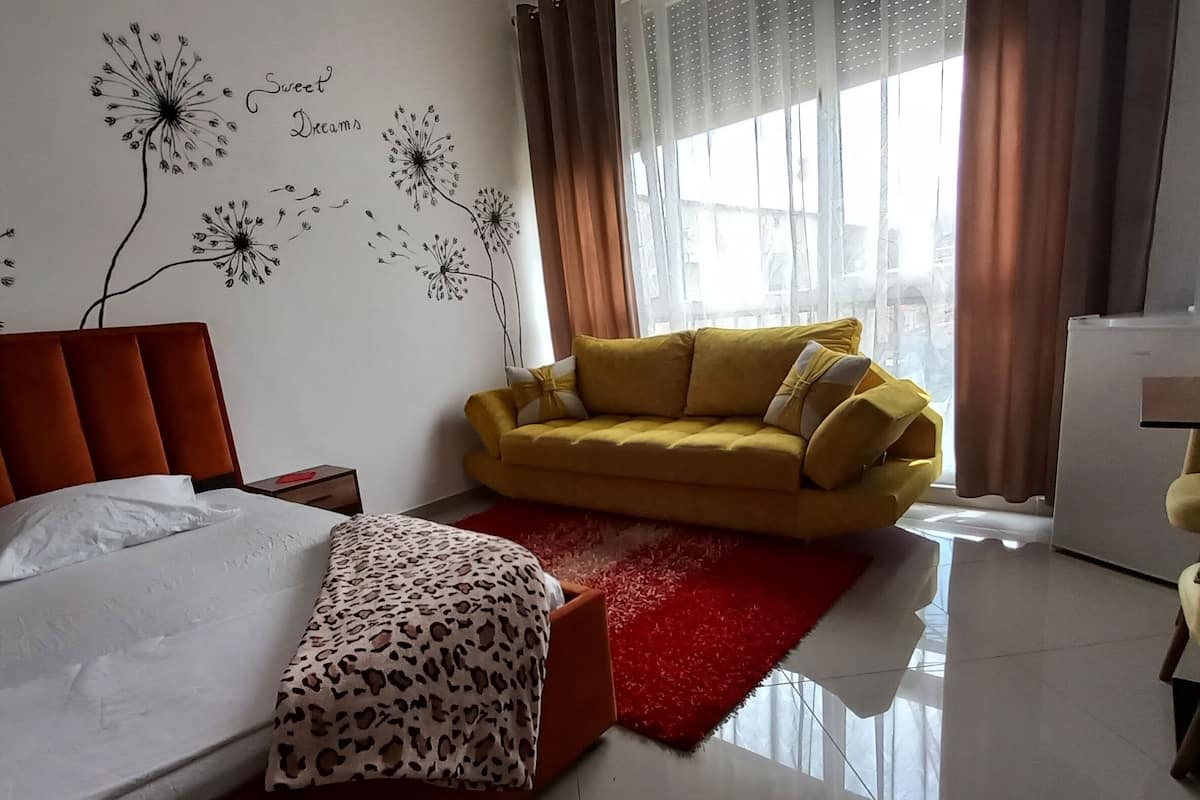 Standard Studio, Courtyard View | Living area | 32-inch Smart TV with digital channels