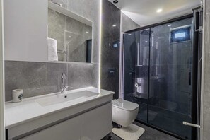 Shower, hair dryer, towels, soap