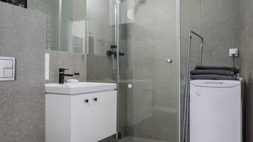 Classic Apartment, Garden View | Bathroom | Shower, hair dryer, towels, soap