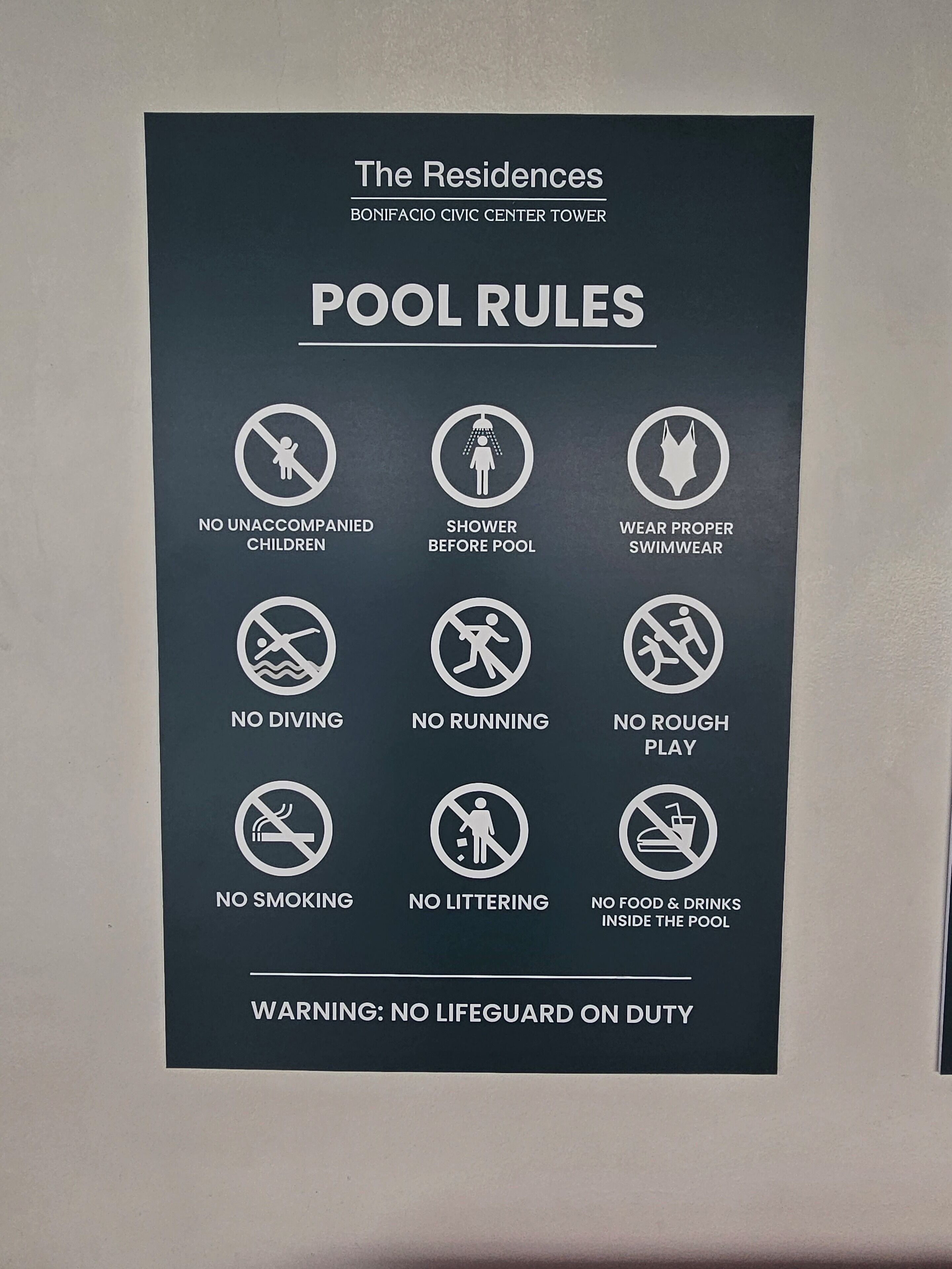 A pool rules sign at The Residences, Bonifacio Civic Center Tower.