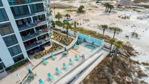 A multi-story hotel with outdoor seating areas and a pool. - Unbeatable Views in this 3BR 3BA Condo at the Watercrest w/Beach Chairs! (Panama City Beach)