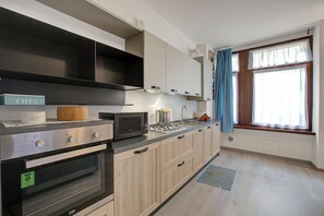 Family Apartment, Multiple Bedrooms (Riva Nest) | Private kitchen | Fridge, microwave, oven, stovetop