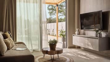 Superior Duplex, Garden View | Living area | TV