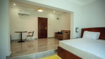 Deluxe Studio, Balcony, City View | In-room safe, individually furnished, desk, laptop workspace