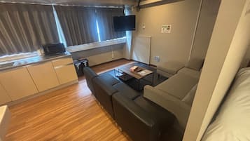 Comfort Quadruple Room | Living area