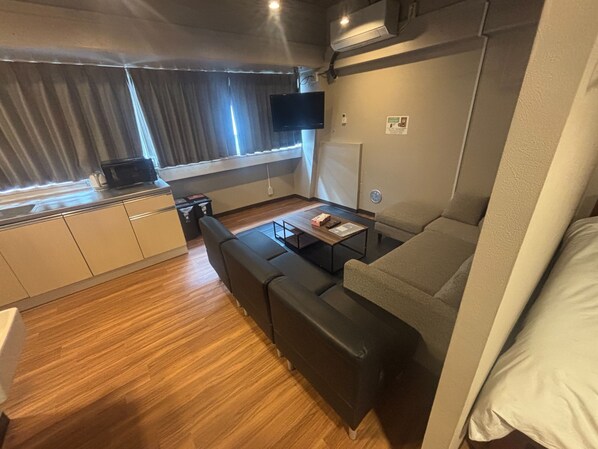 Quarto quádruplo conforto | Área de estar