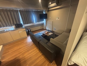 Habitación cuádruple Confort | Área de sala de estar