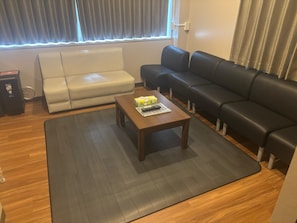 Premium Quadruple Room | Living area