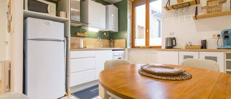 Fridge, coffee/tea maker, cookware/dishes/utensils