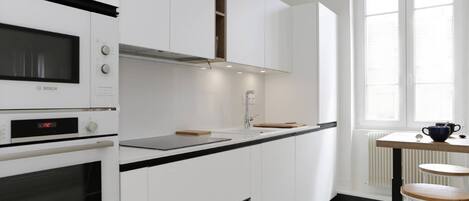 Fridge, oven, coffee/tea maker, cookware/dishes/utensils